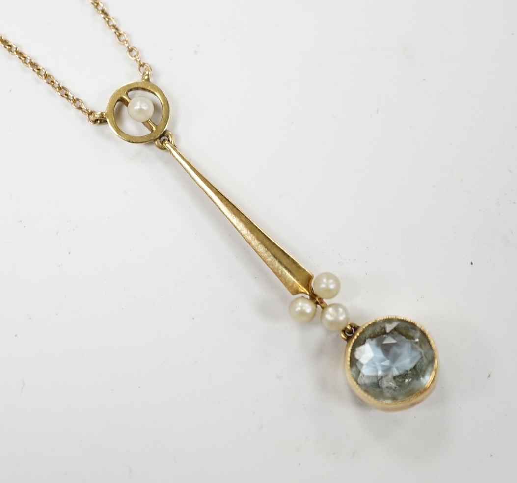 An Edwardian 15ct, aquamarine and seed pearl set drop pendant necklace, pendant 38mm, chain knotted, gross weight 2.9 grams. Condition - fair